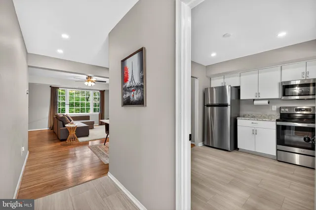 a kitchen with a sink cabinets and window