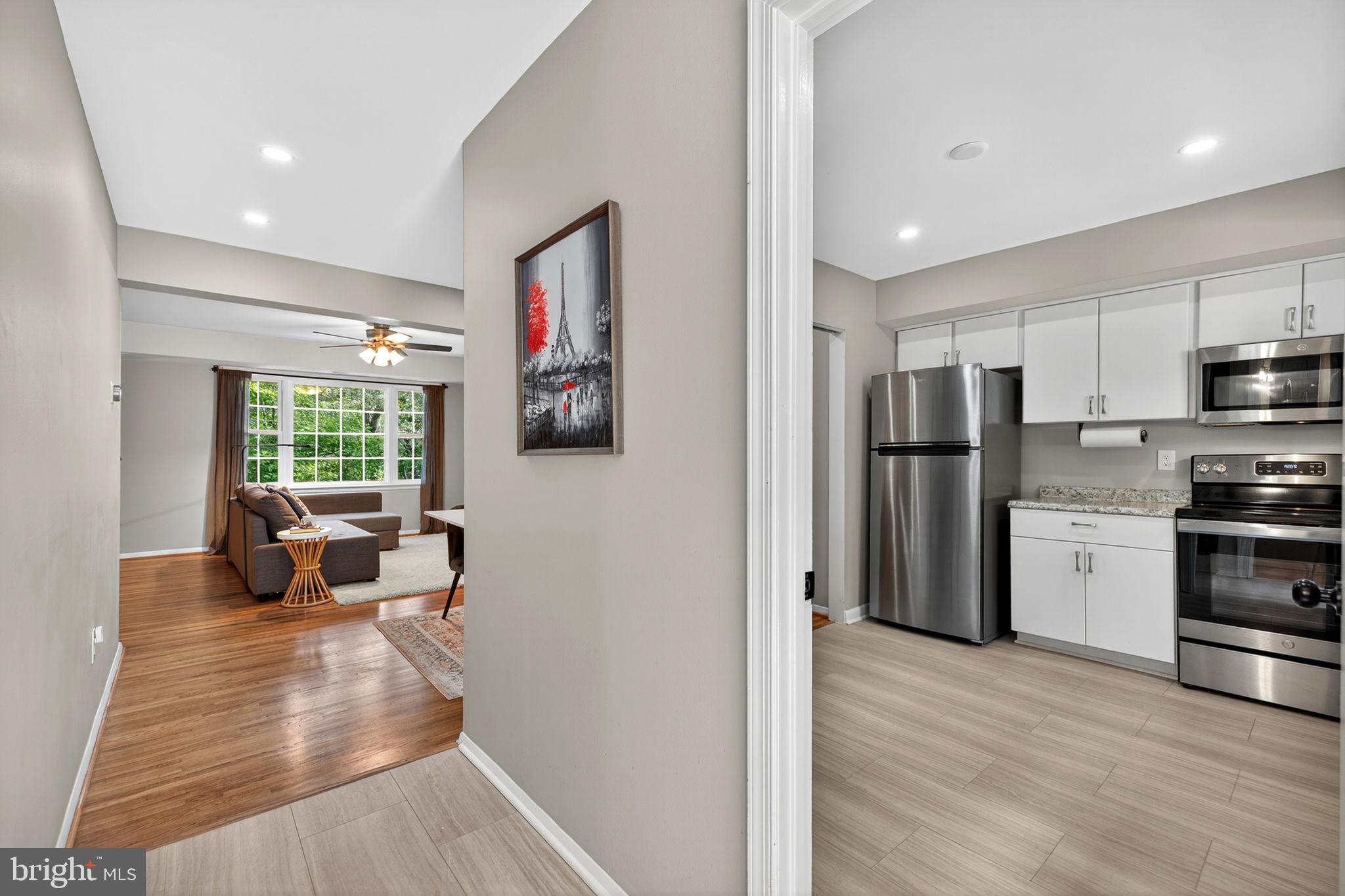 6517 Orono Court Springfield, VA 22152 - Photo 5 of 64 a kitchen with stainless steel appliances a refrigerator and a stove top oven