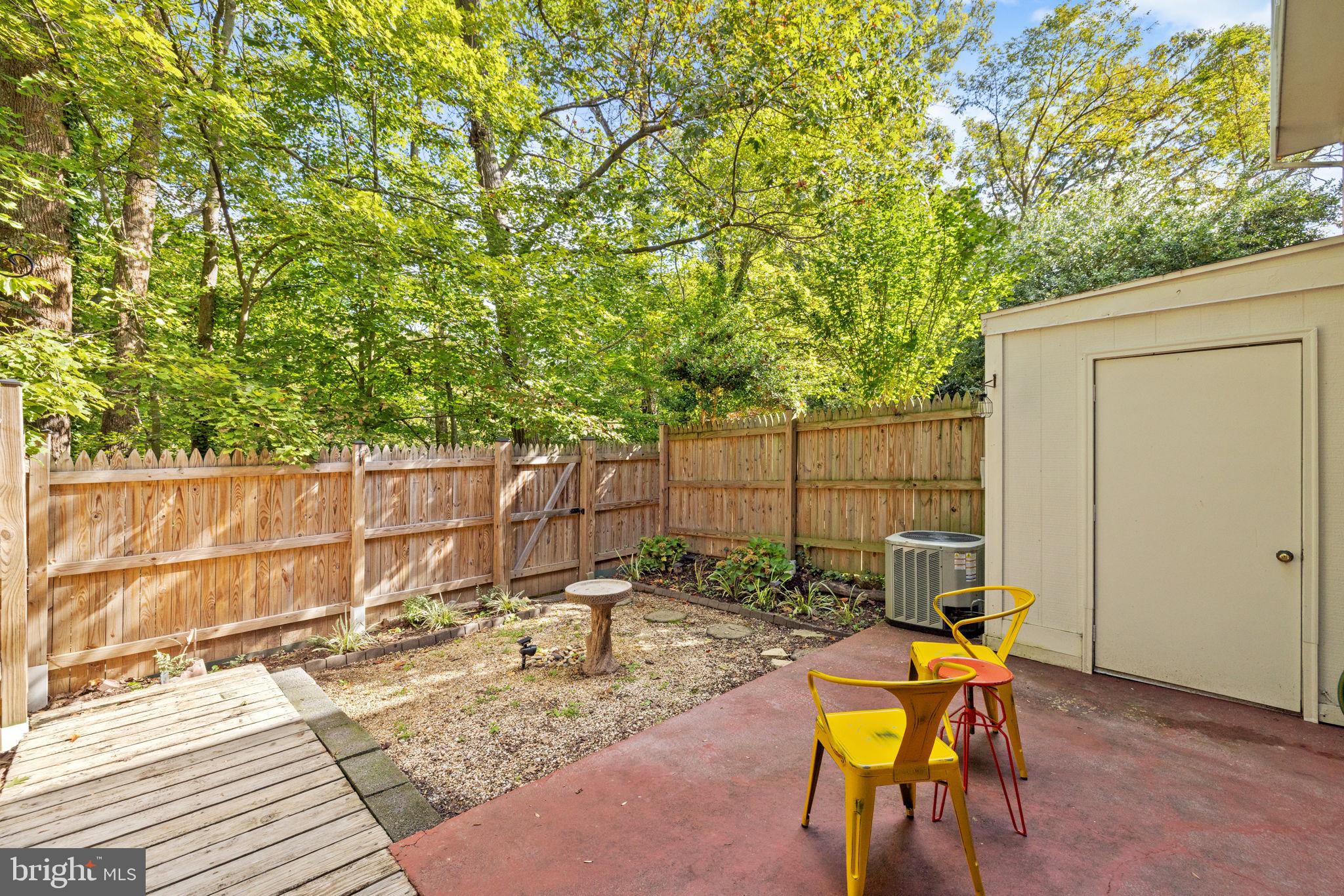 6517 Orono Court Springfield, VA 22152 - Photo 53 of 64 a backyard of a house with table and chairs
