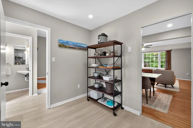 a kitchen with stainless steel appliances granite countertop a refrigerator stove microwave and sink