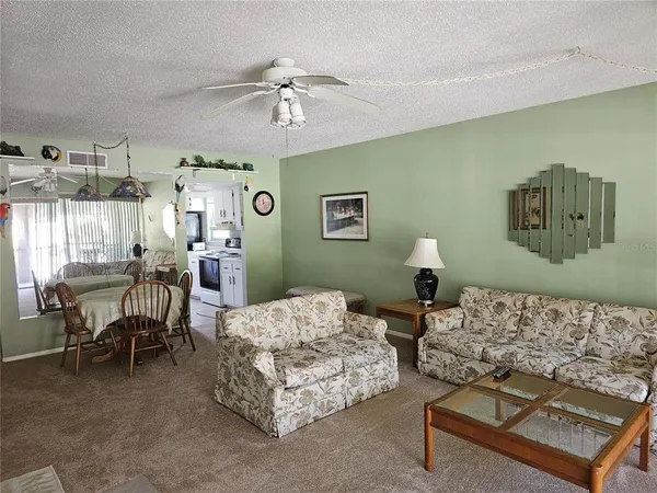 a bedroom with two beds and painting on the wall