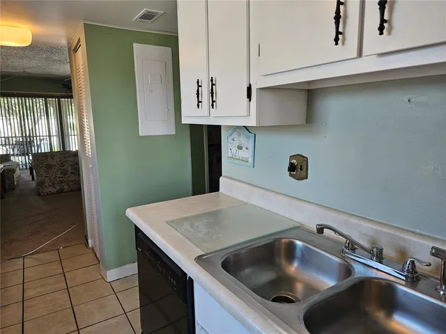 a kitchen with a cabinets and window