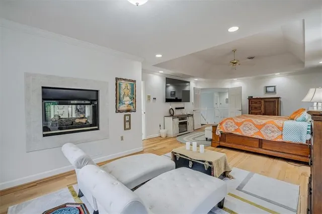 a bedroom with a bed window and couch