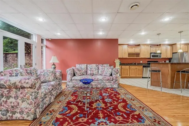 a large kitchen with kitchen island a sink wooden floor and counter space