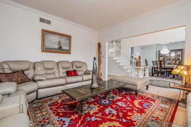 a living room with furniture and a rug