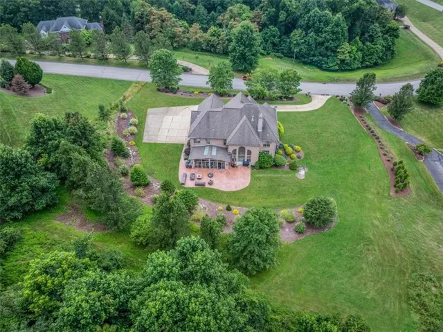 an aerial view of a house with outdoor space and street view