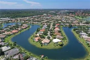 an aerial view of a house with a lake view