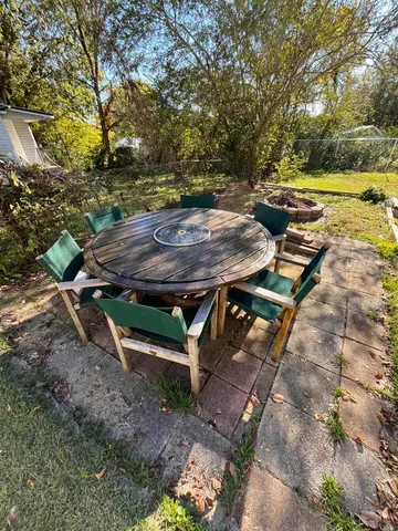 a view of a backyard with wooden floor