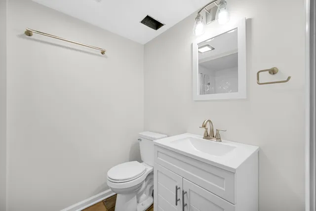 a view of a kitchen with a sink and cabinets