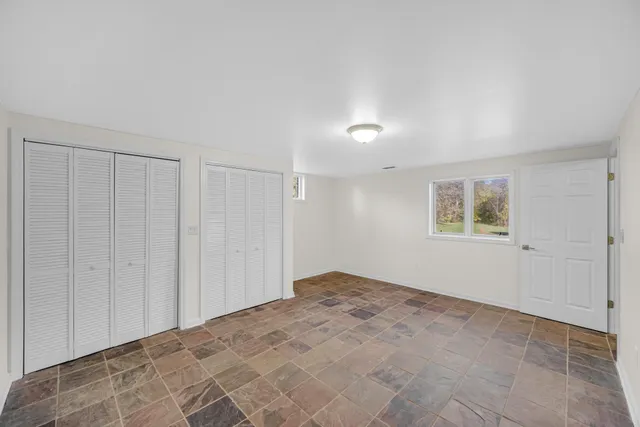 a bathroom with a toilet sink and shower