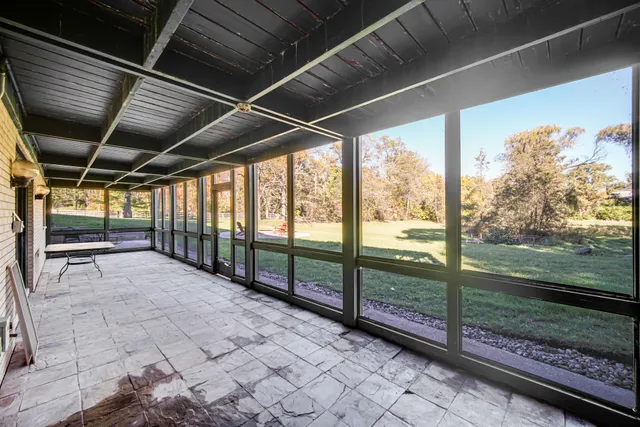 a view of a house with a yard and a garden