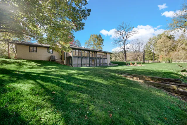 a view of a chair and table and chairs in the garden