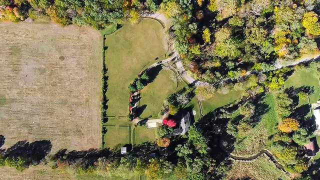 a kitchen with a sink cabinets and wooden floor