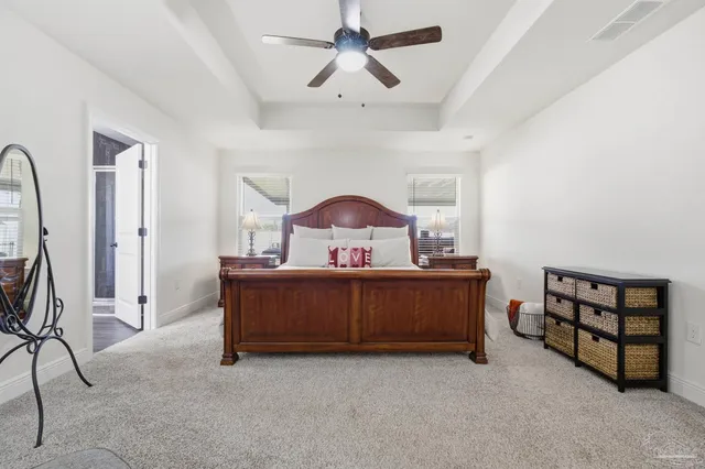 a bedroom with furniture and a window
