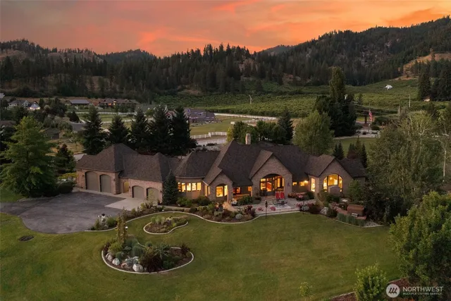 an aerial view of a house with garden space lake view and mountain view
