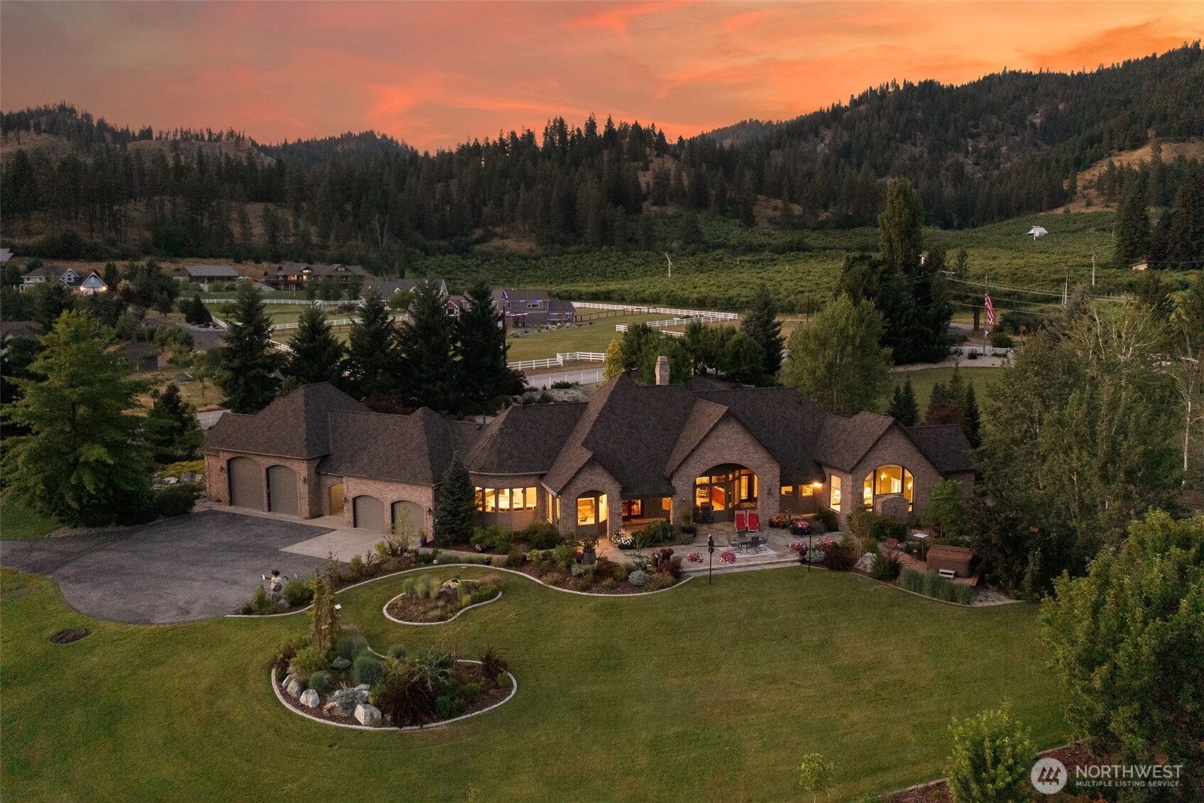 an aerial view of a house with garden space lake view and mountain view