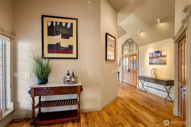 a living room with furniture a rug and a window