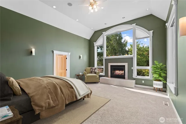 a bed room with a bed and a fireplace