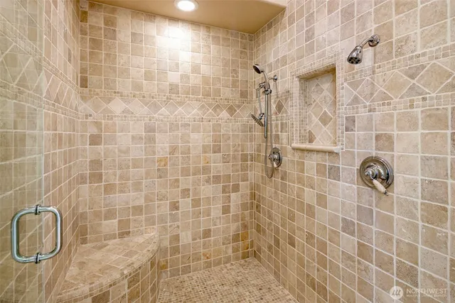 a spacious bedroom with a large bed and a window