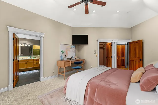 a bed room with a bed and a chair