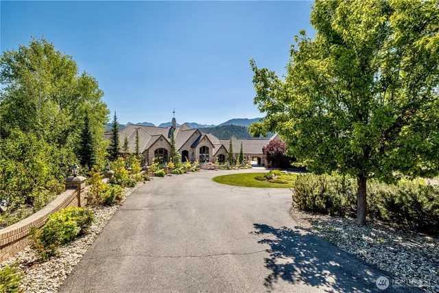 an aerial view of a house with mountain view