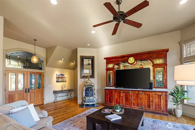 a living room with furniture and a flat screen tv