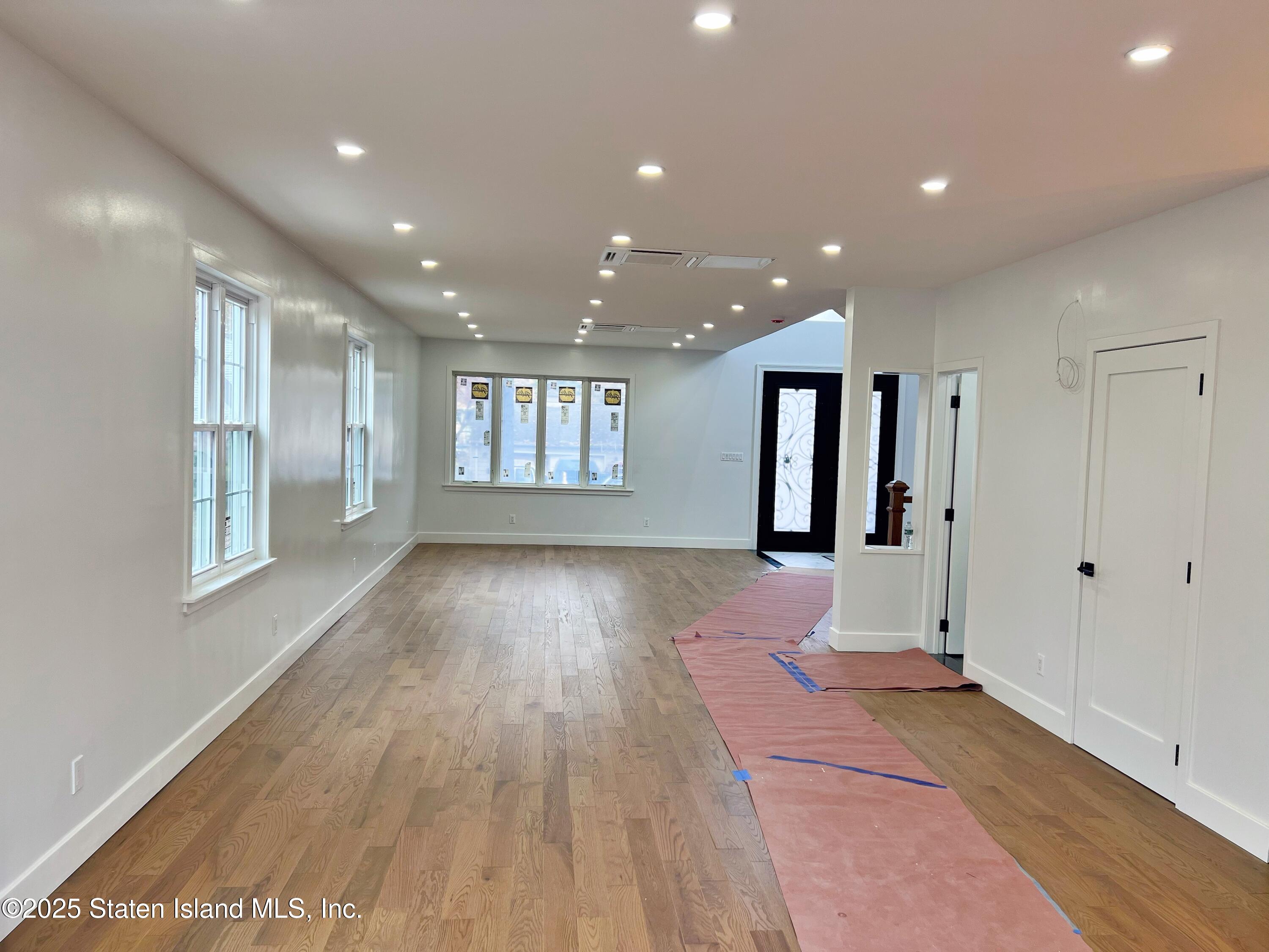 32 Remsen Street Staten Island, NY 10304 - Photo 11 of 41 a view of an empty room with wooden floor and a window