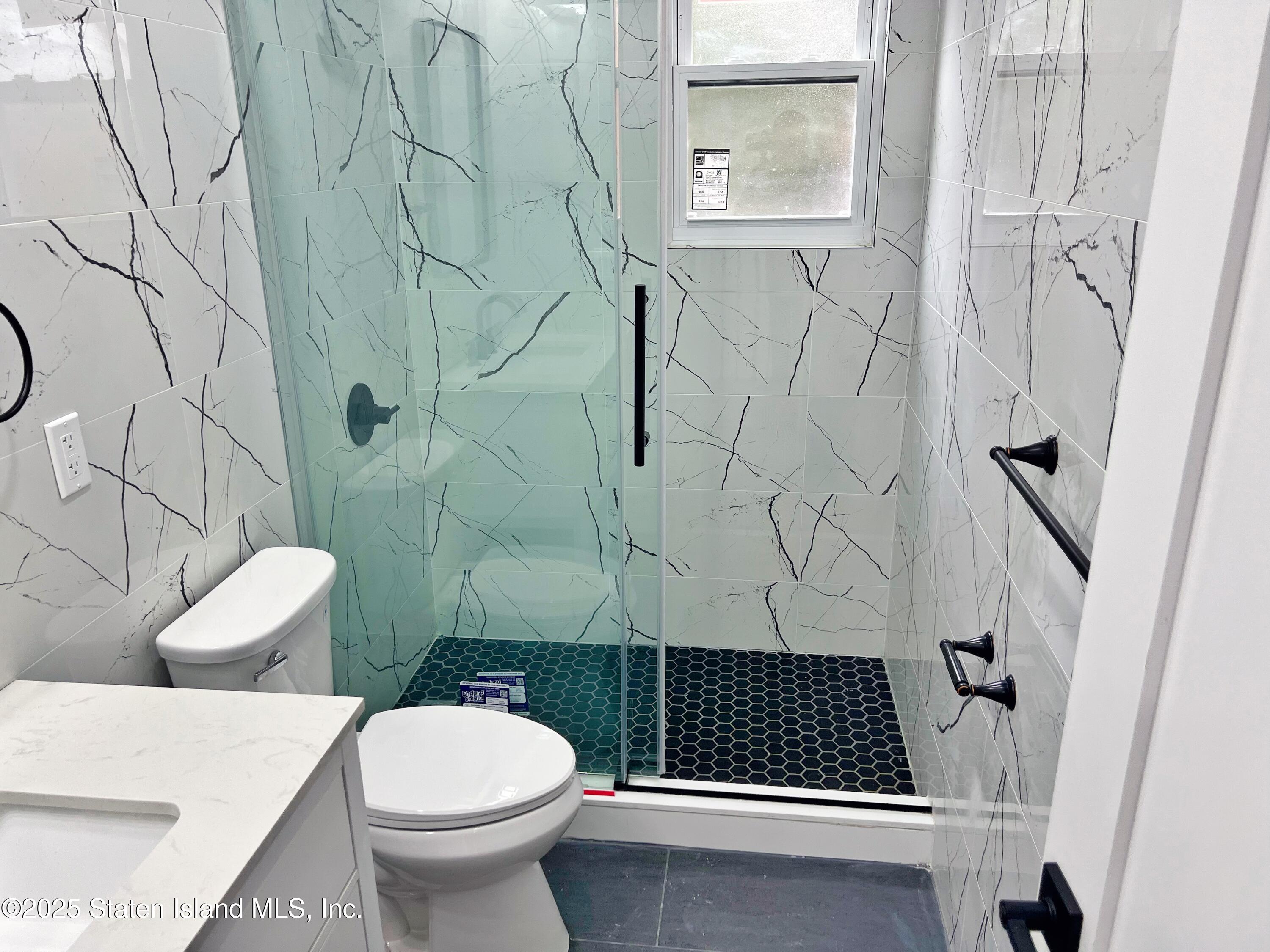 32 Remsen Street Staten Island, NY 10304 - Photo 15 of 41 a bathroom with a toilet and a shower