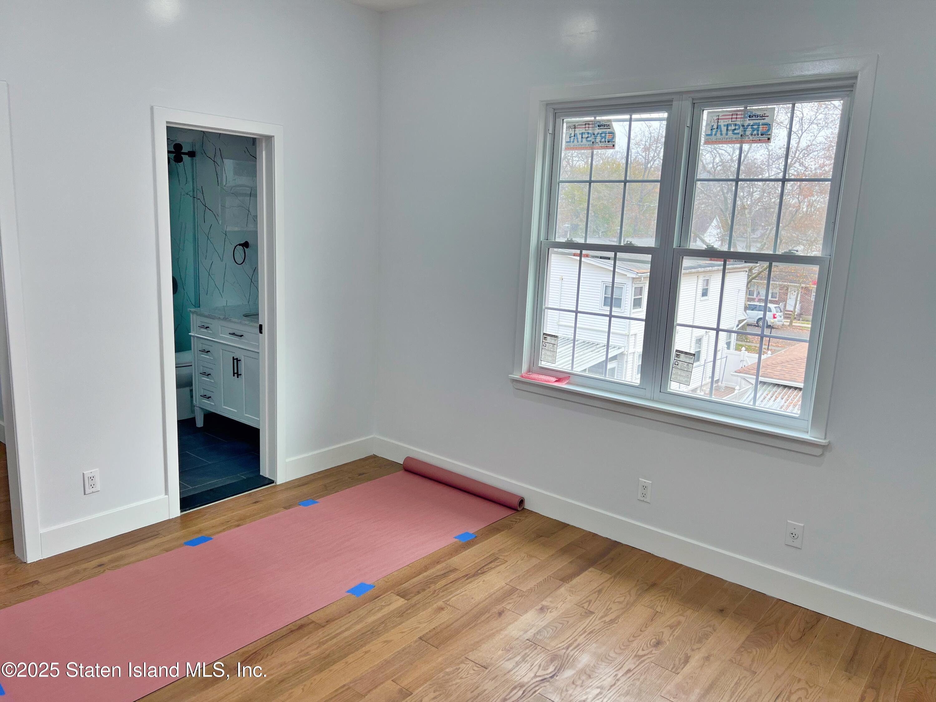 32 Remsen Street Staten Island, NY 10304 - Photo 20 of 41 an empty room with windows and closet