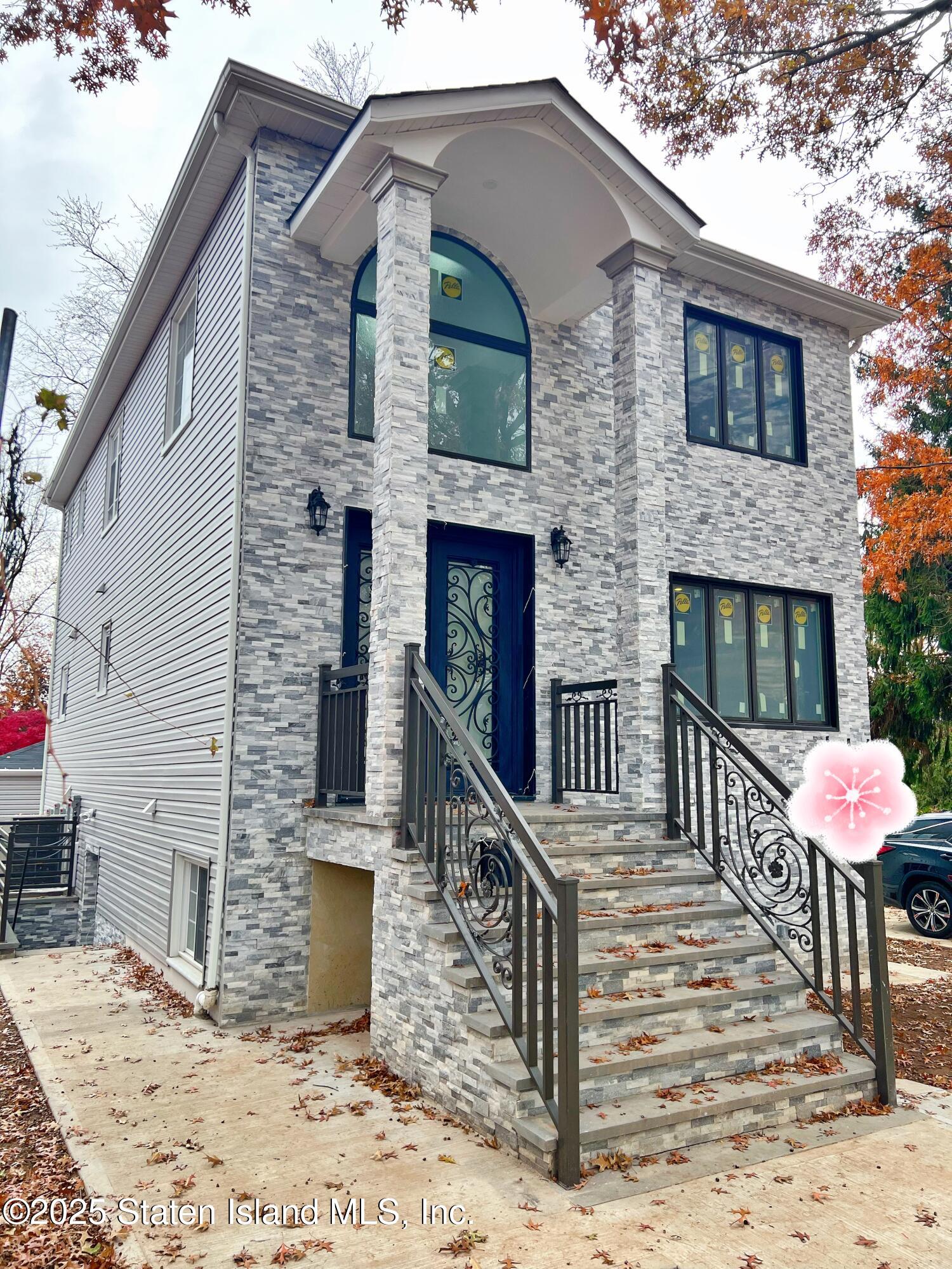 32 Remsen Street Staten Island, NY 10304 - Photo 2 of 41 a front view of a house with stairs