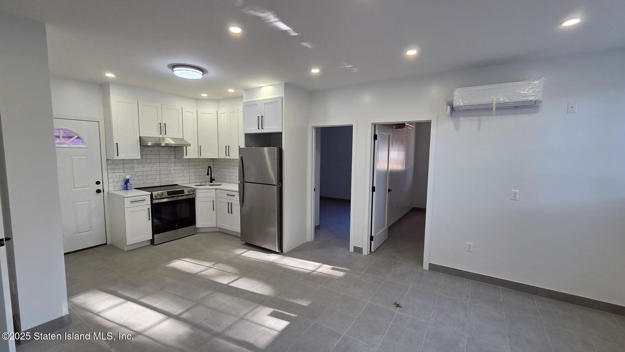 32 Remsen Street Staten Island, NY 10304 - Photo 33 of 41 a kitchen with stainless steel appliances a refrigerator sink and stove