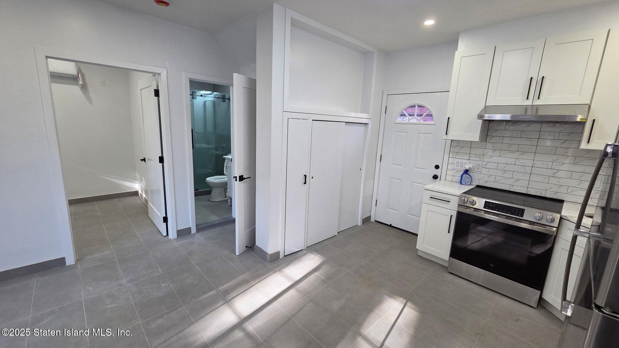 32 Remsen Street Staten Island, NY 10304 - Photo 37 of 41 a kitchen with stainless steel appliances a refrigerator and a stove