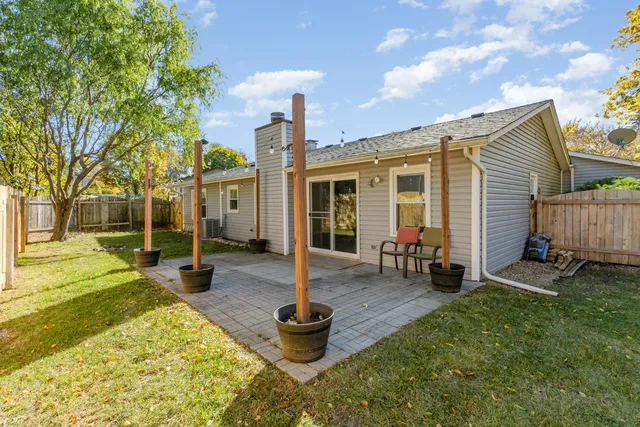 a front view of a house with garden and patio