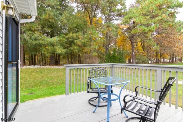 a view of a chair and table on the balcony