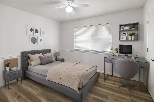 a bedroom with a bed and a table