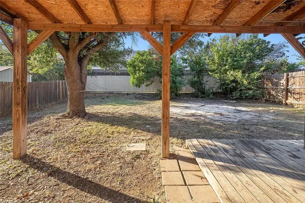 a view of a backyard of the house