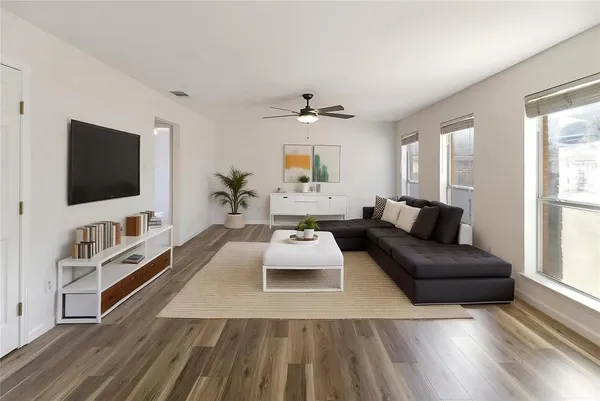 a living room with furniture and a flat screen tv