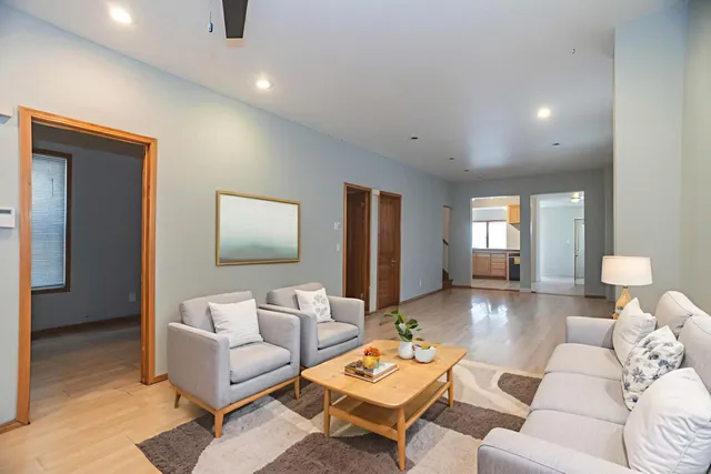 a living room with furniture and a table