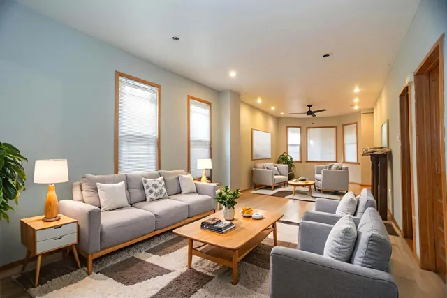 a living room with furniture and a large window