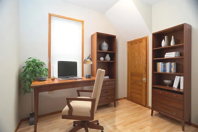 a view of a workspace with furniture