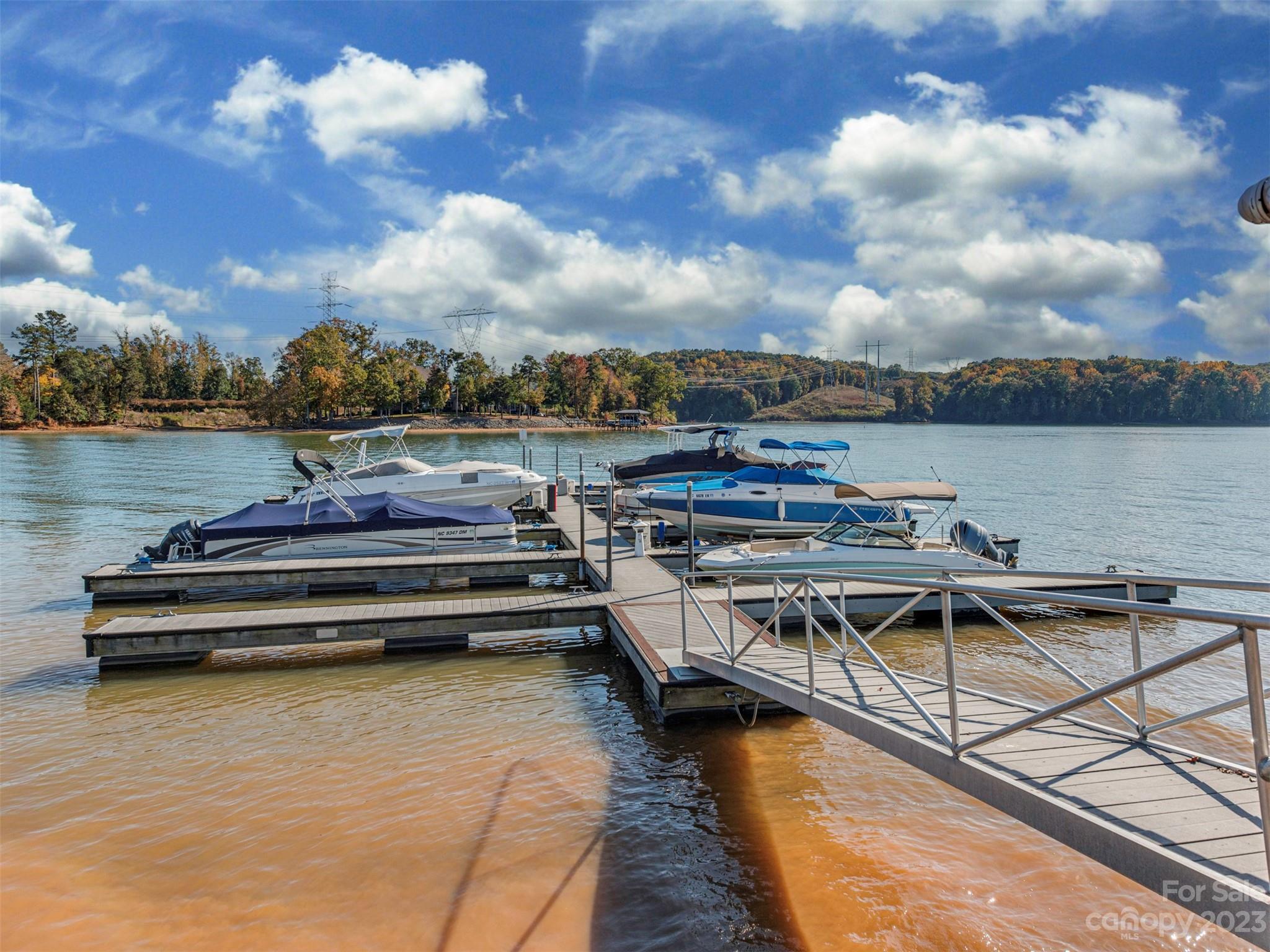 1208 Reflection Pointe Boulevard Belmont, NC 28012 - Photo 5 of 24 a view of a lake with chairs