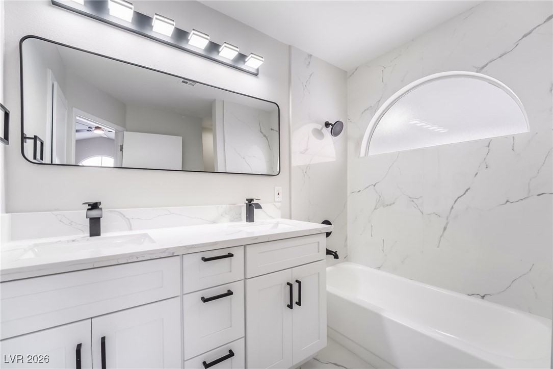 2850 Nikki Place Henderson, NV 89074 - Photo 20 of 64 Full bathroom with double vanity and shower combination