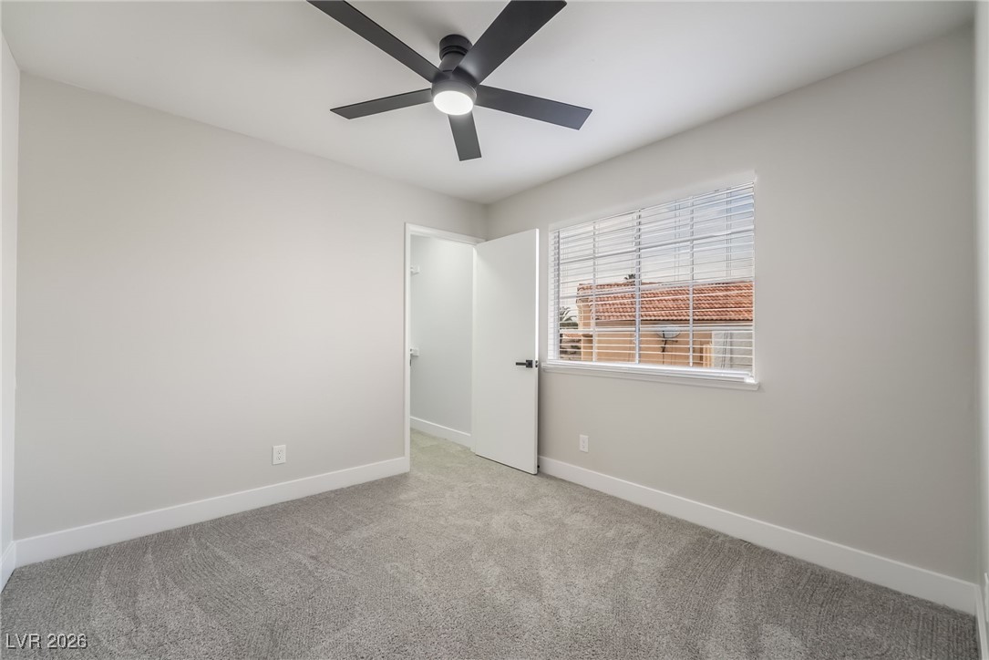 2850 Nikki Place Henderson, NV 89074 - Photo 23 of 64 Unfurnished room featuring carpet flooring and ceiling fan