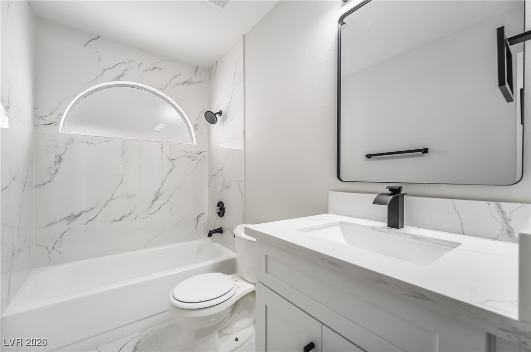 2850 Nikki Place Henderson, NV 89074 - Photo 26 of 64 Full bathroom featuring vanity and bathing tub / shower combination