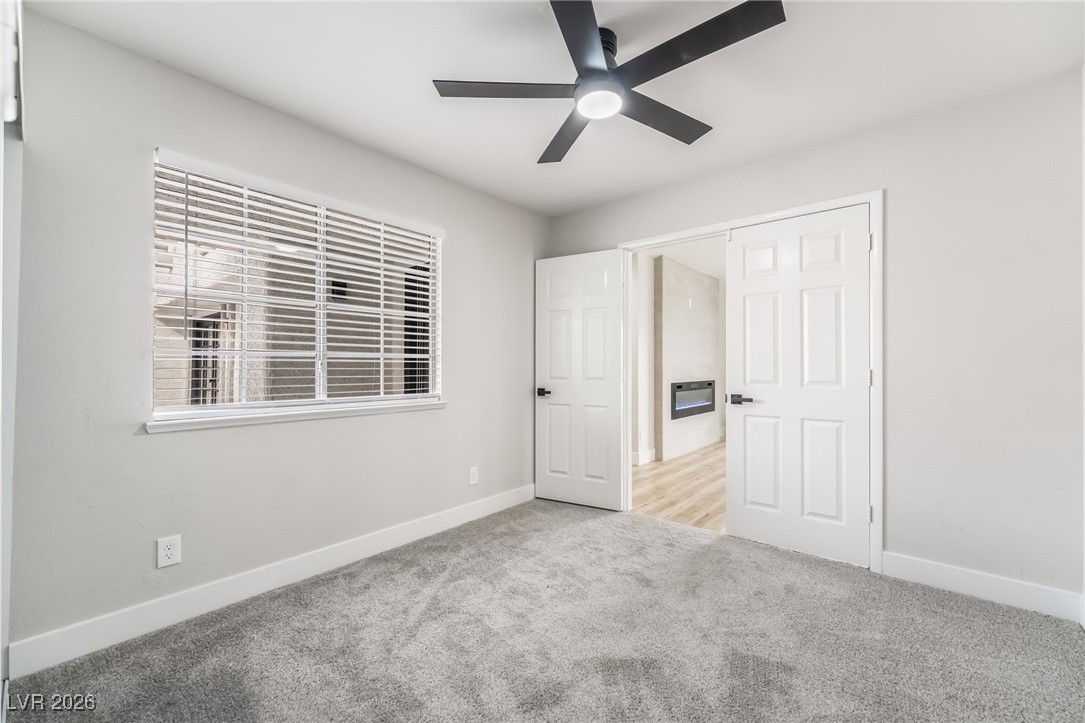 2850 Nikki Place Henderson, NV 89074 - Photo 28 of 64 Unfurnished bedroom with carpet floors and a ceiling fan