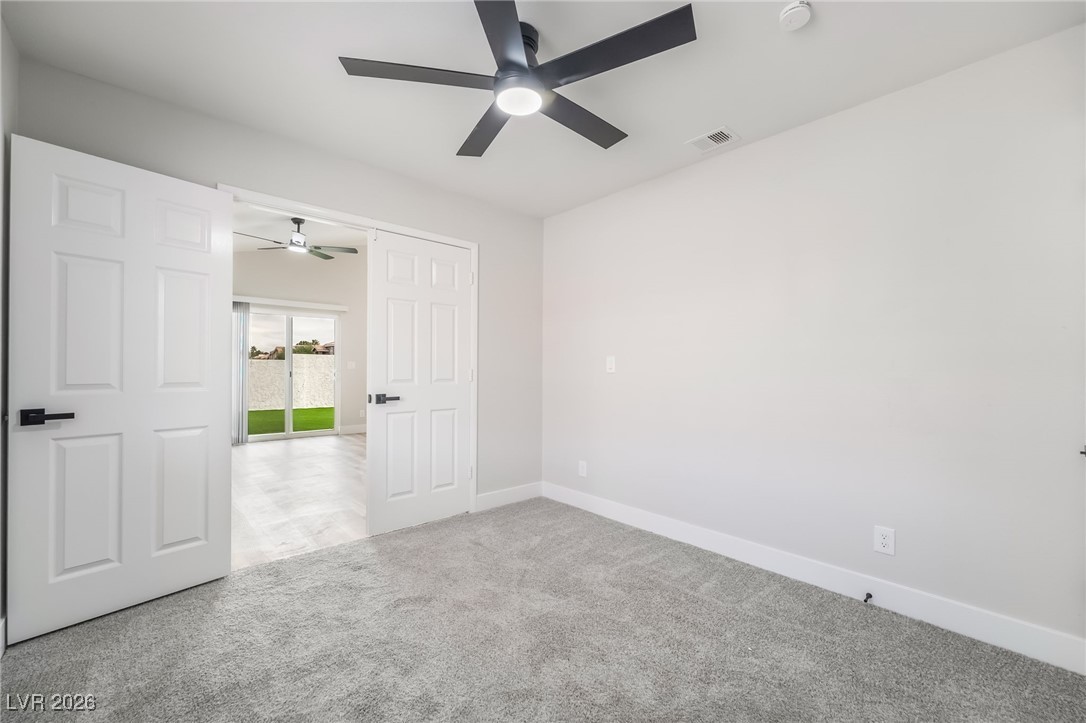 2850 Nikki Place Henderson, NV 89074 - Photo 29 of 64 Unfurnished room with carpet flooring and ceiling fan