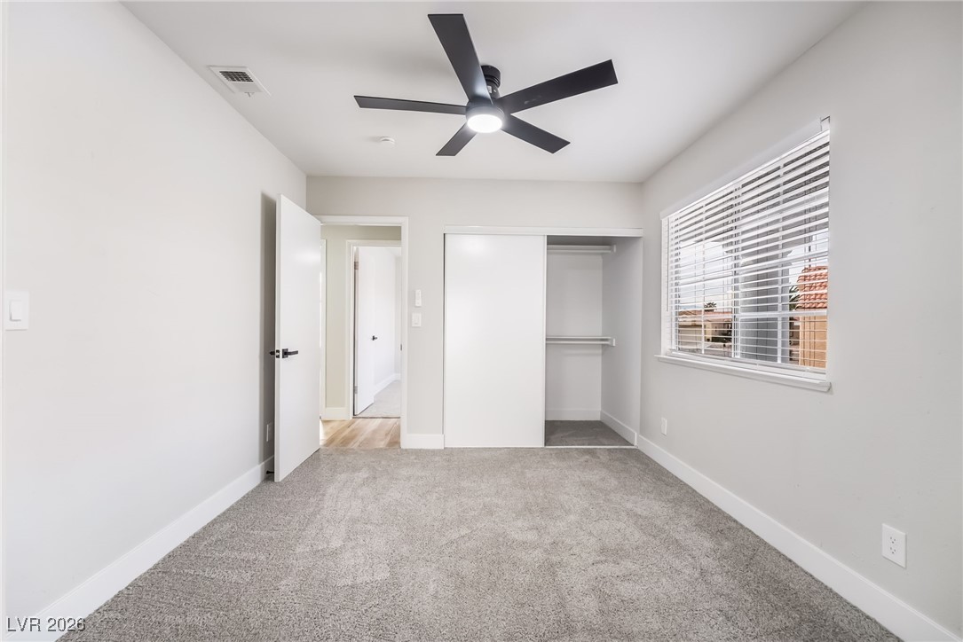 2850 Nikki Place Henderson, NV 89074 - Photo 30 of 64 Unfurnished bedroom with light carpet, a closet, and ceiling fan