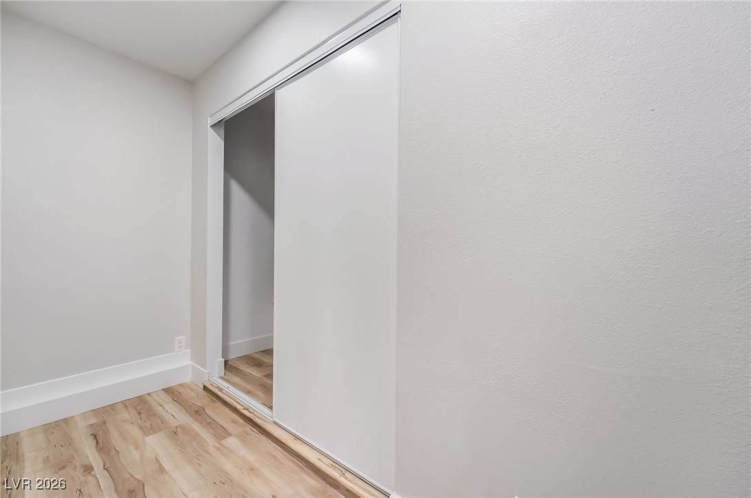 2850 Nikki Place Henderson, NV 89074 - Photo 31 of 64 Hallway with wood finished floors and baseboards