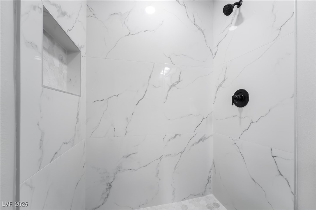 2850 Nikki Place Henderson, NV 89074 - Photo 38 of 64 Bathroom featuring a marble finish shower