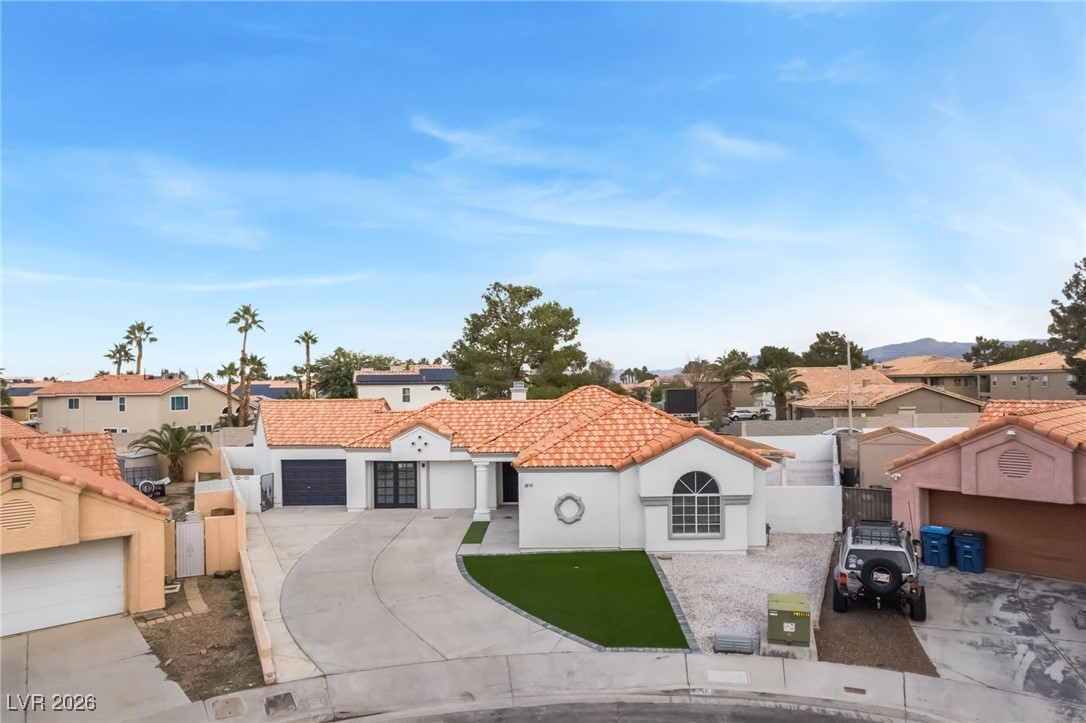 2850 Nikki Place Henderson, NV 89074 - Photo 47 of 64 Mediterranean / spanish home with a residential view, driveway, stucco siding, and a tiled roof